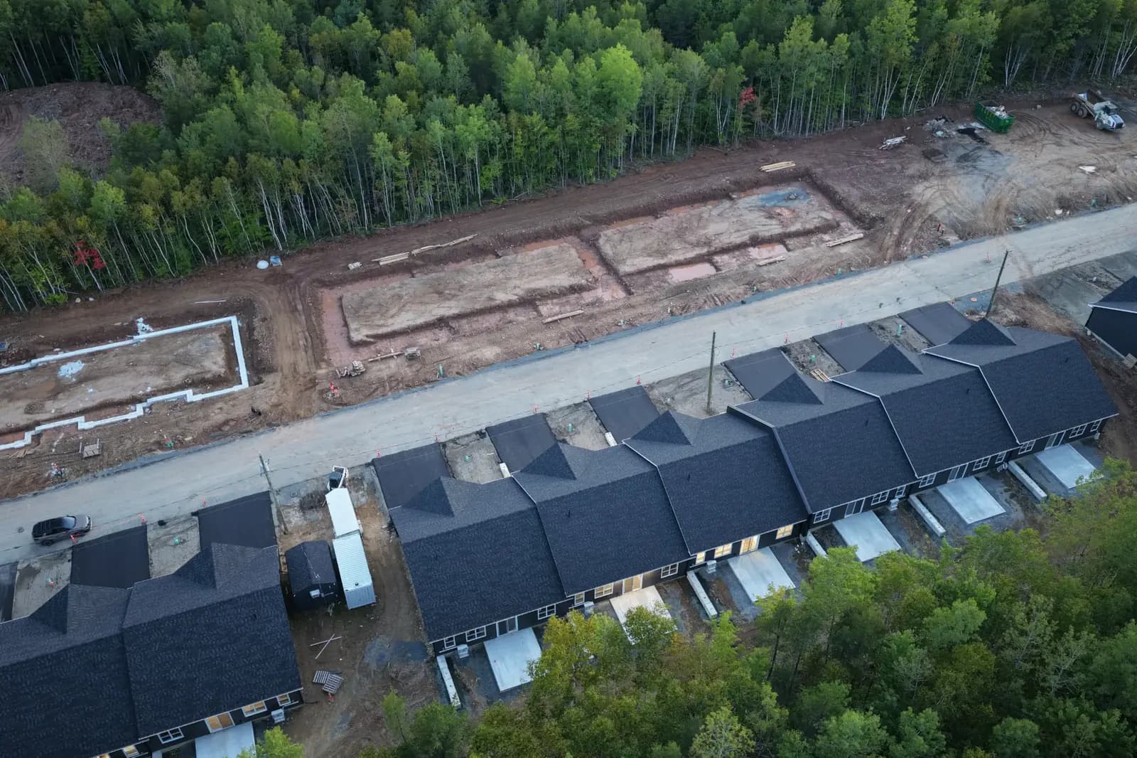 Aerial view of new foundations and completed homes