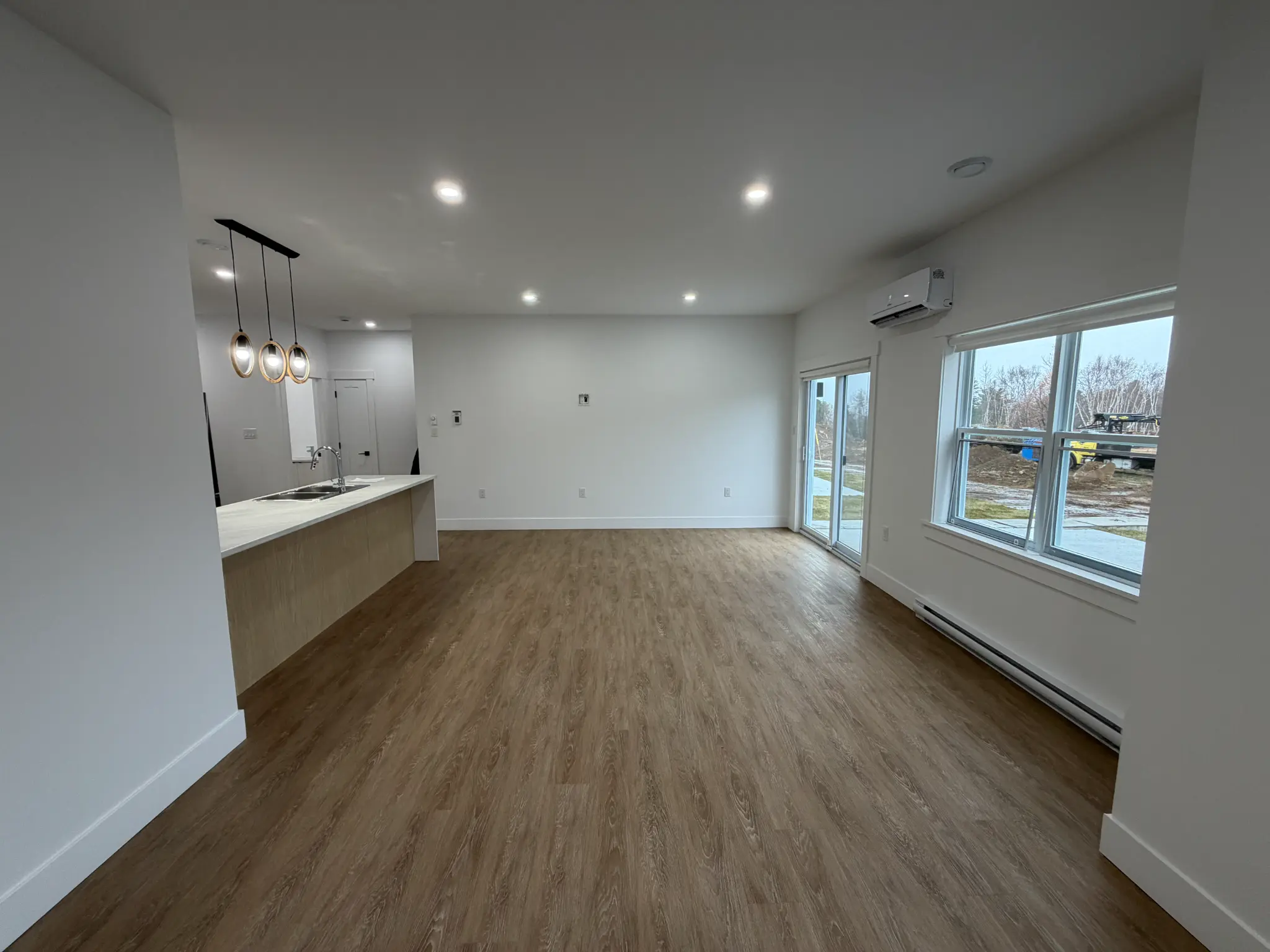 Open concept living area with kitchen island